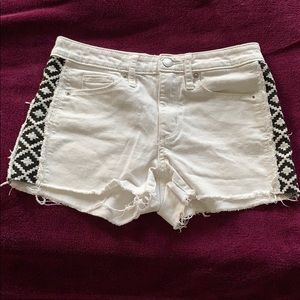 White shorts with black and white pattern on side